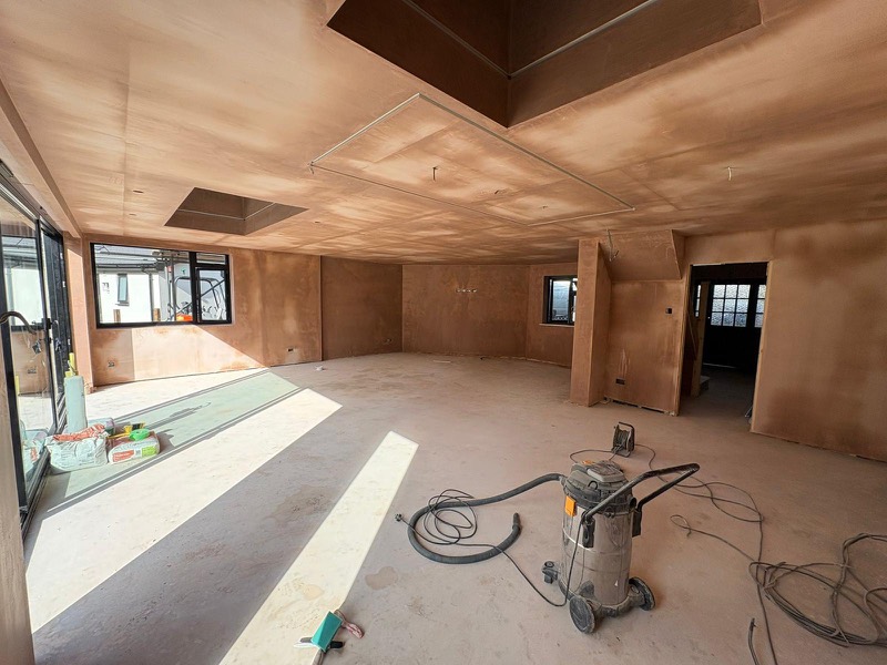 Freshly plastered open plan room with a skylight