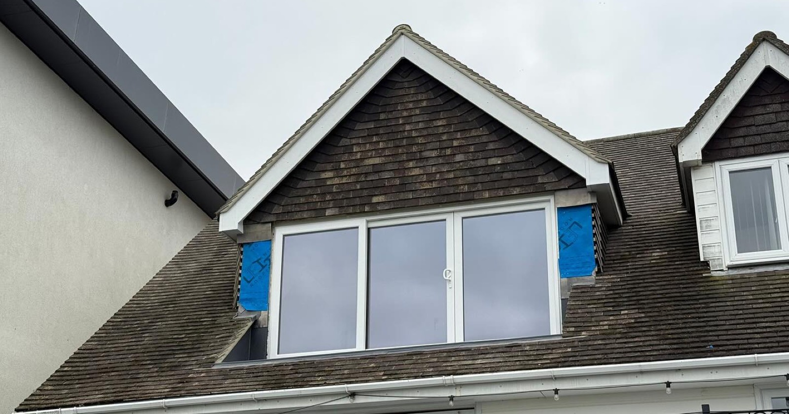 Tiled roof with a gable dormer going in
