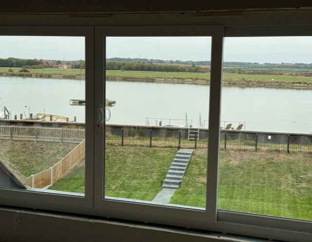 River view through a triple sliding window
